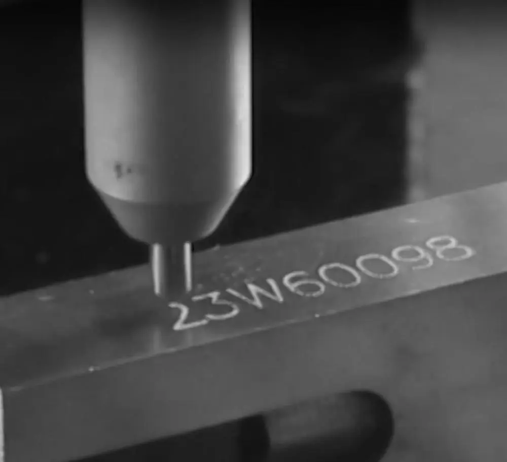 machine writing on metal
