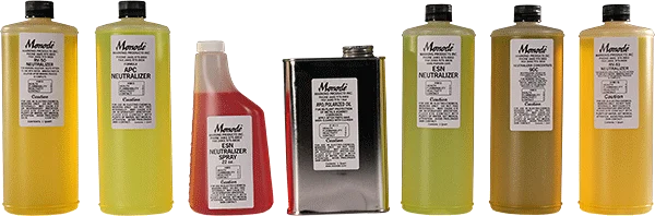 A collection of seven Monodi chemical bottles and containers in various sizes and colors