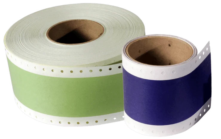 Two rolls of continuous feed computer paper with sprocket holes, one green and one blue