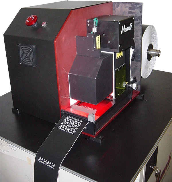 Monode industrial laser marking and label processing machine with a roll of black label material feeding through it